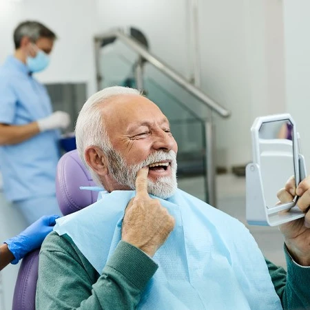 man smiling after sedation dentistry at dentist