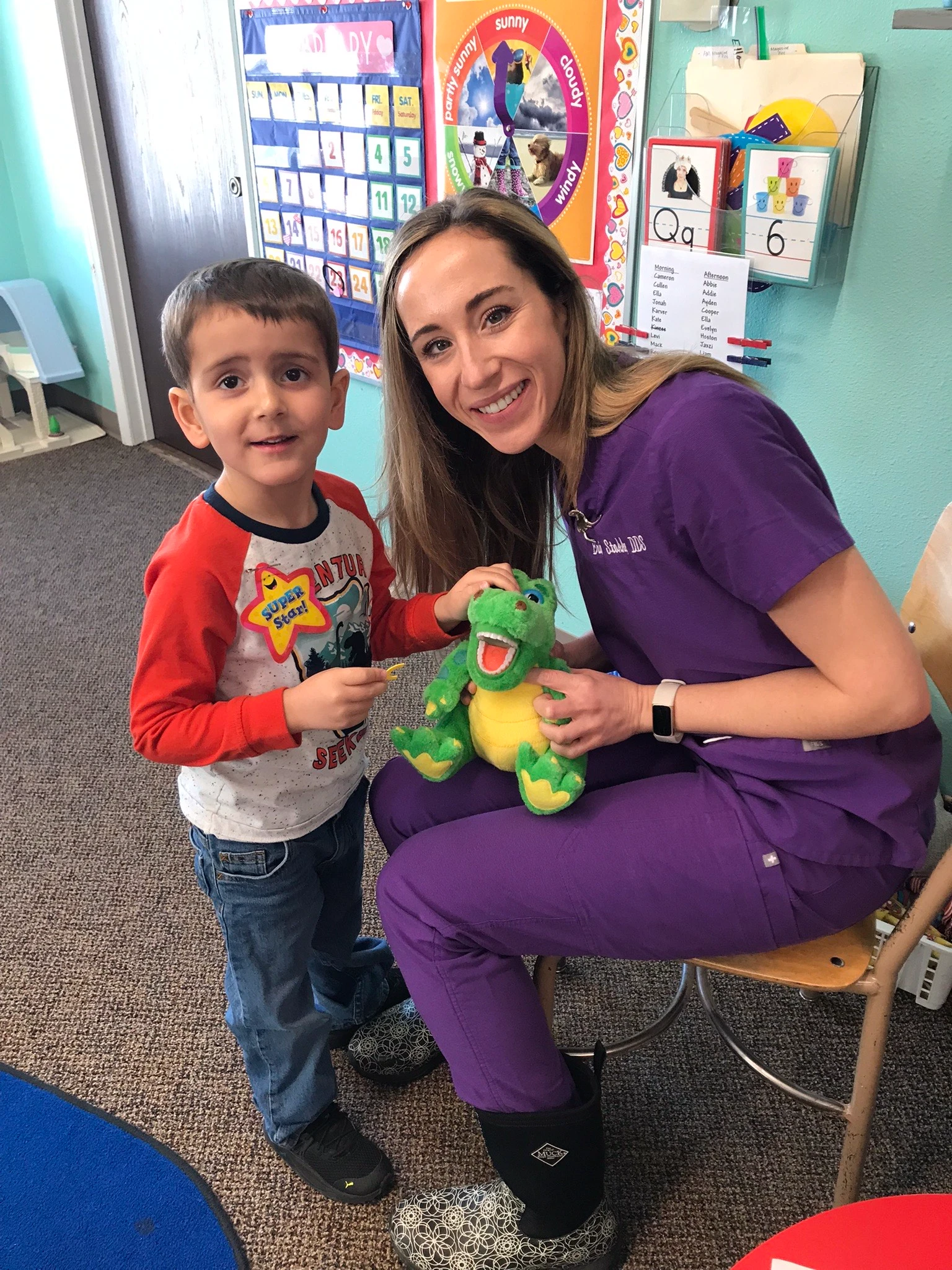 Dr. Erica Stokke smiling with child | Pediatric Dentistry | best pediatric dentist in Laurel, Montana